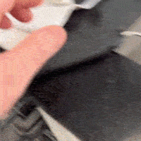 Dishwasher-safe adjustable angle spatula being rinsed